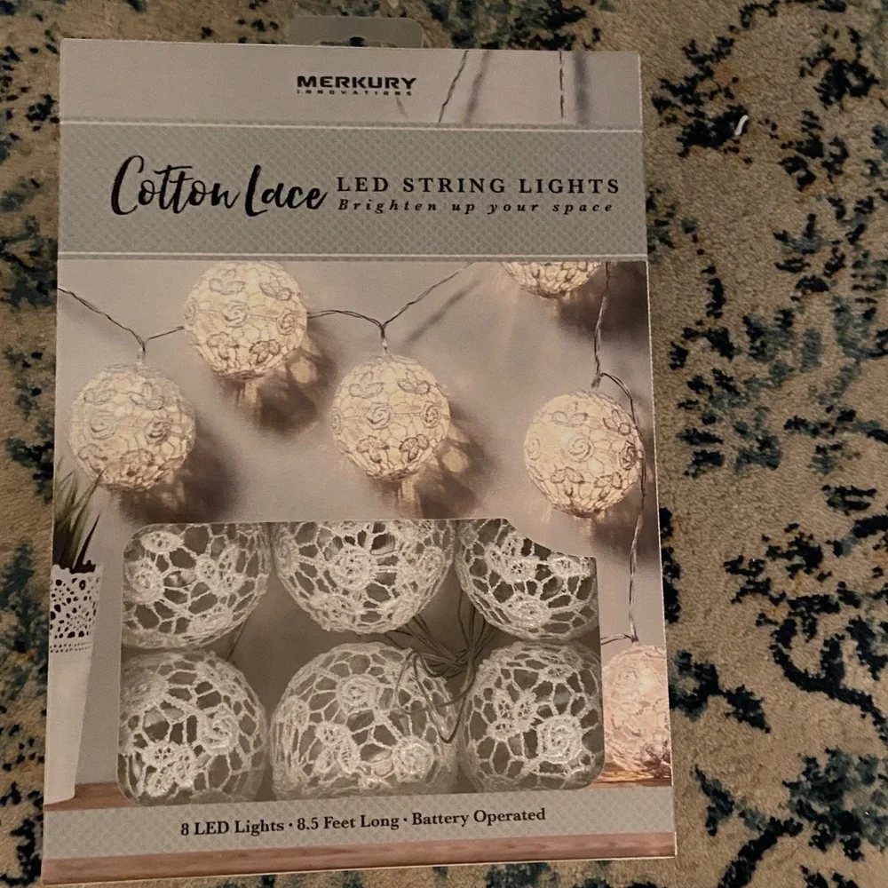 Mercury Innovations Cotton Clear Globe LED String Lights wrapped in white lace.